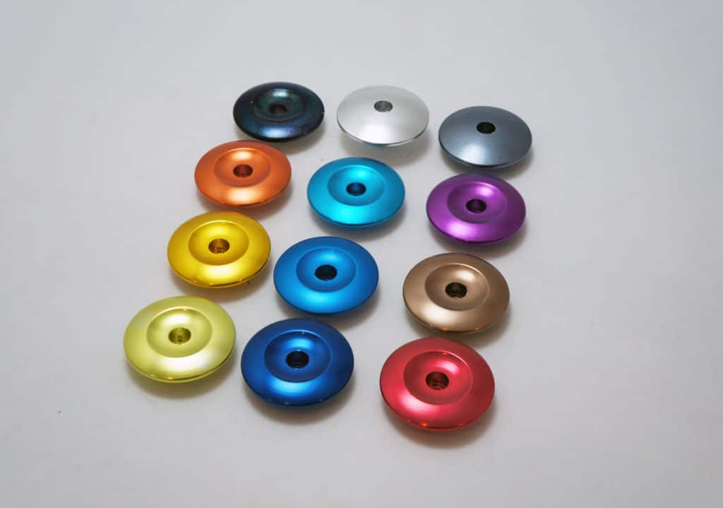 colorful fine alum anodizing parts in line on table