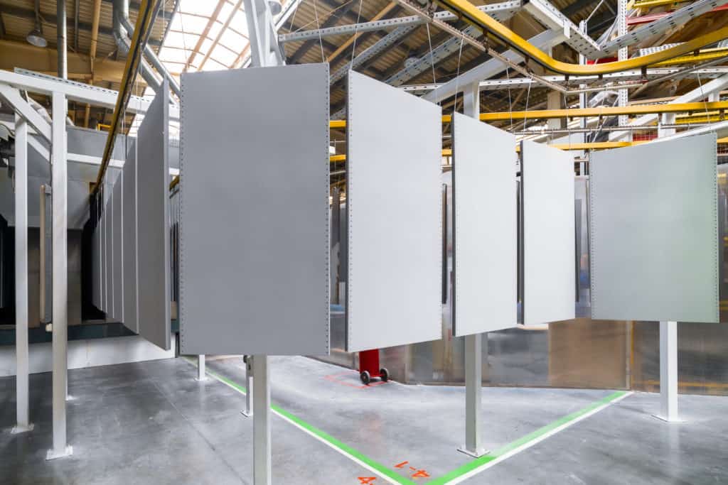 metal panels on a powder coating conveyor line