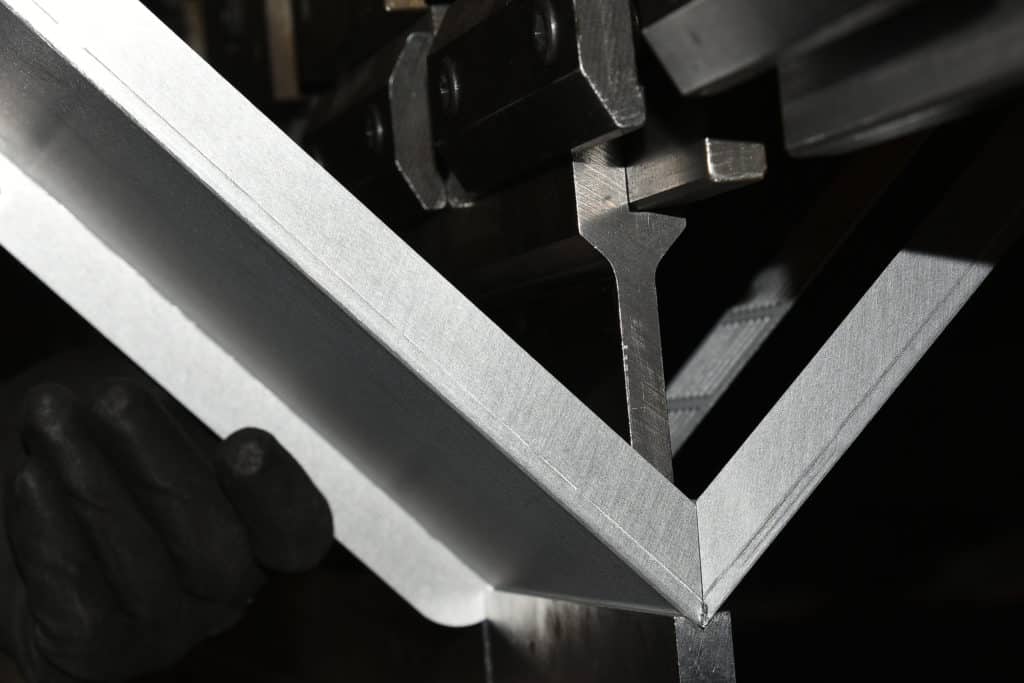close-shot of metal bending.v shape