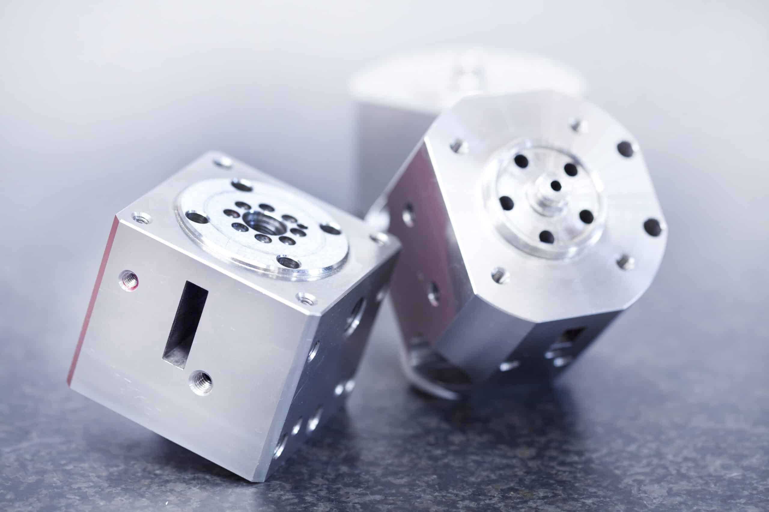 two aluminum machining part line up