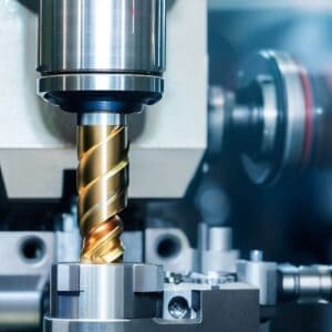 The multi-tasking CNC lathe machine swiss type tapping at the brass shaft .
