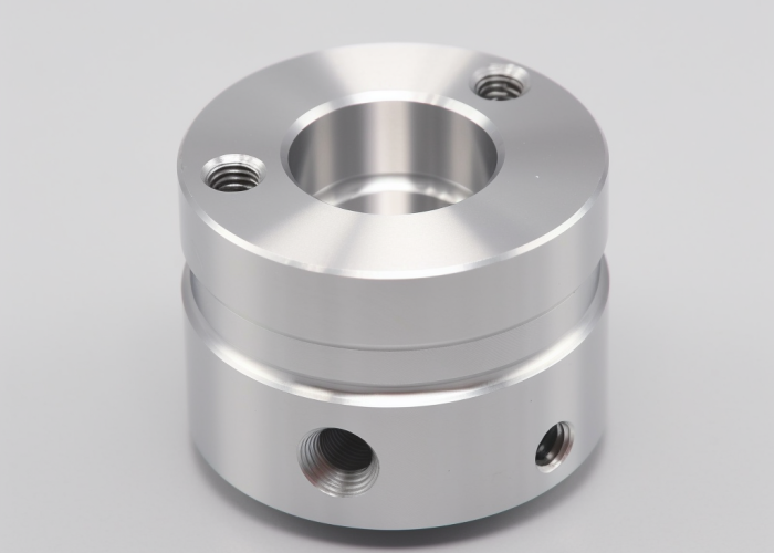 a round aluminum turning component, clear anodizing