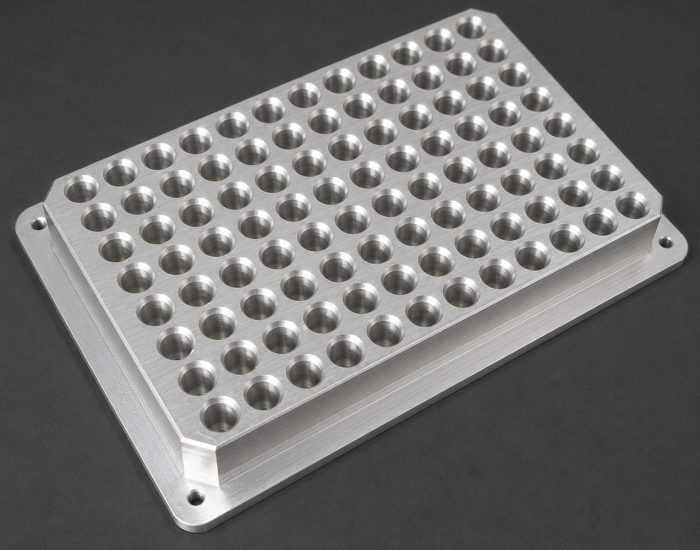 Matte anodized aluminum thermal adapter plate with precision-machined cavity geometry for laboratory plate alignment applications