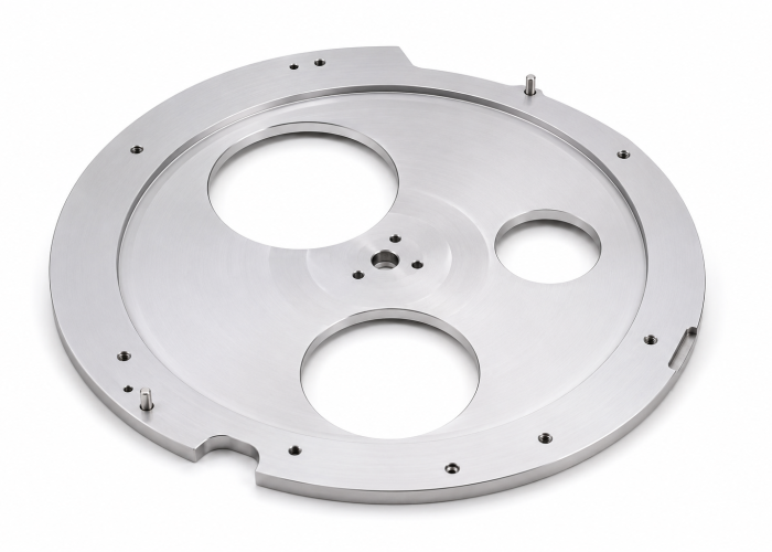 Custom Machined Wafer Carrier Plate Custom machined circular wafer carrier plate with precision locating features, mounting holes, and large cutout regions for semiconductor handling applications.