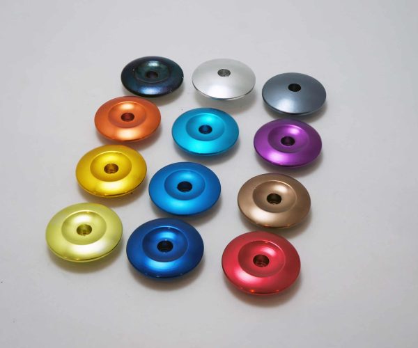 colorful fine alum anodizing parts in line on table