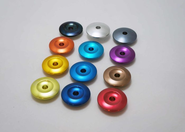 colorful fine alum anodizing parts in line on table