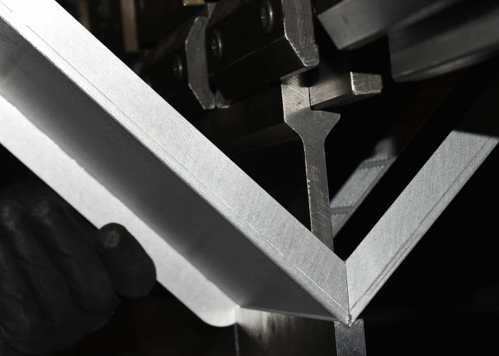 close-shot of metal bending.v shape